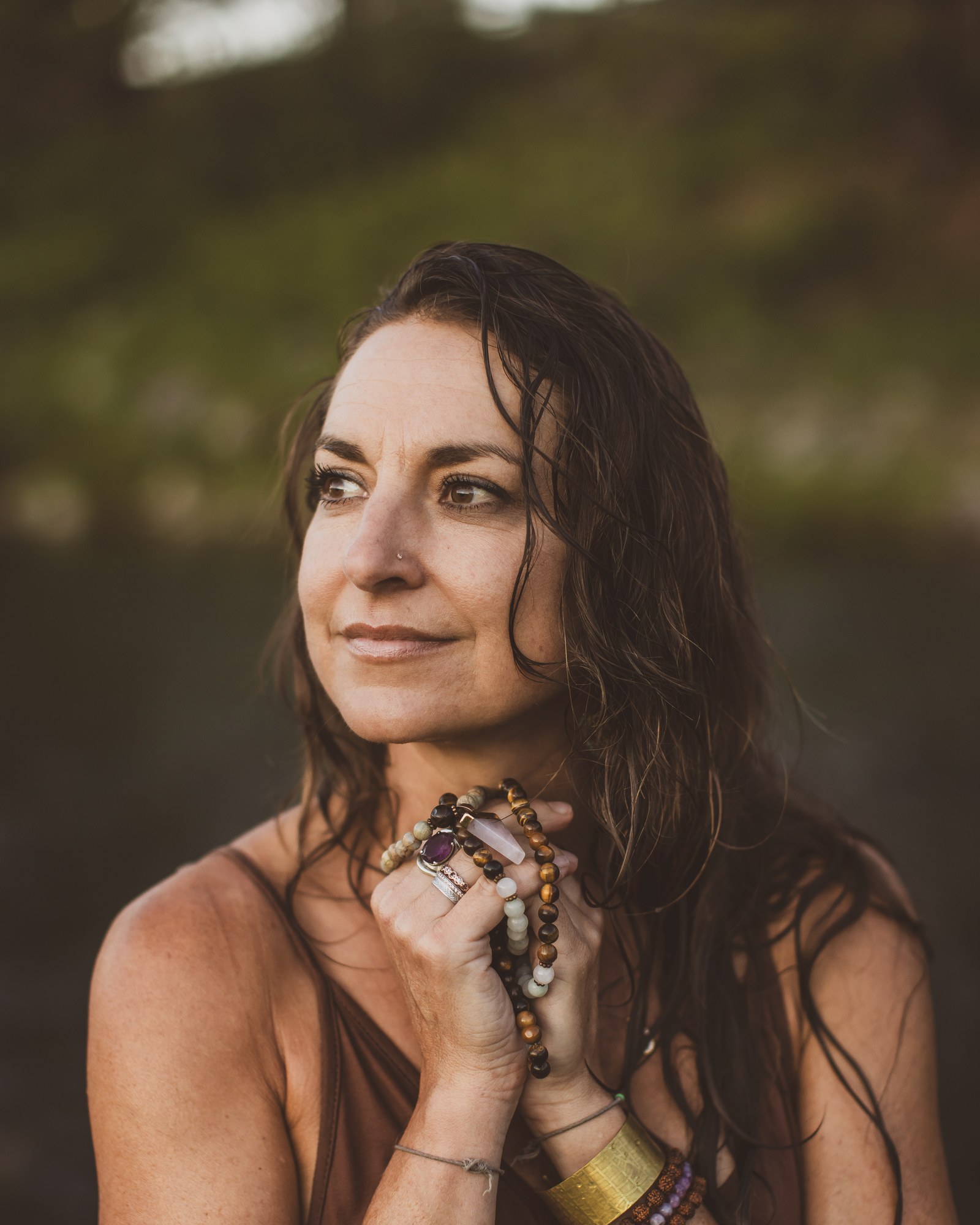 Kaila Leilani standing in a meadow in golden light, smiling